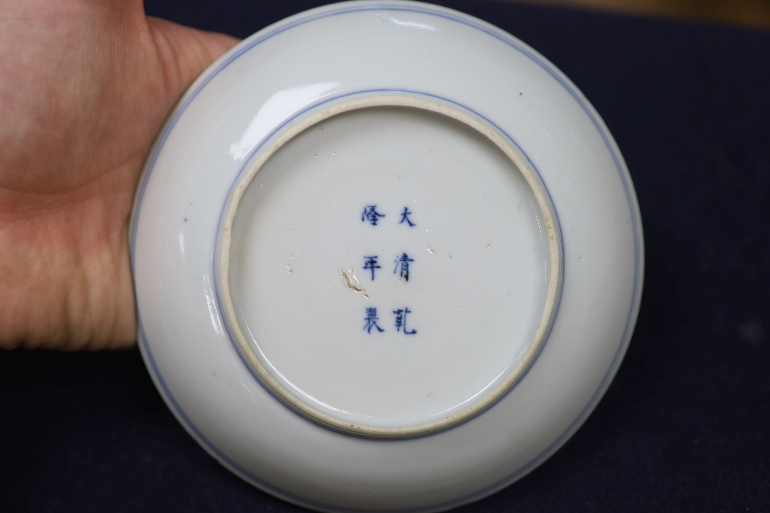 Two Chinese blue and white vases and a dish, together with a famille rose dish, tallest 28cm